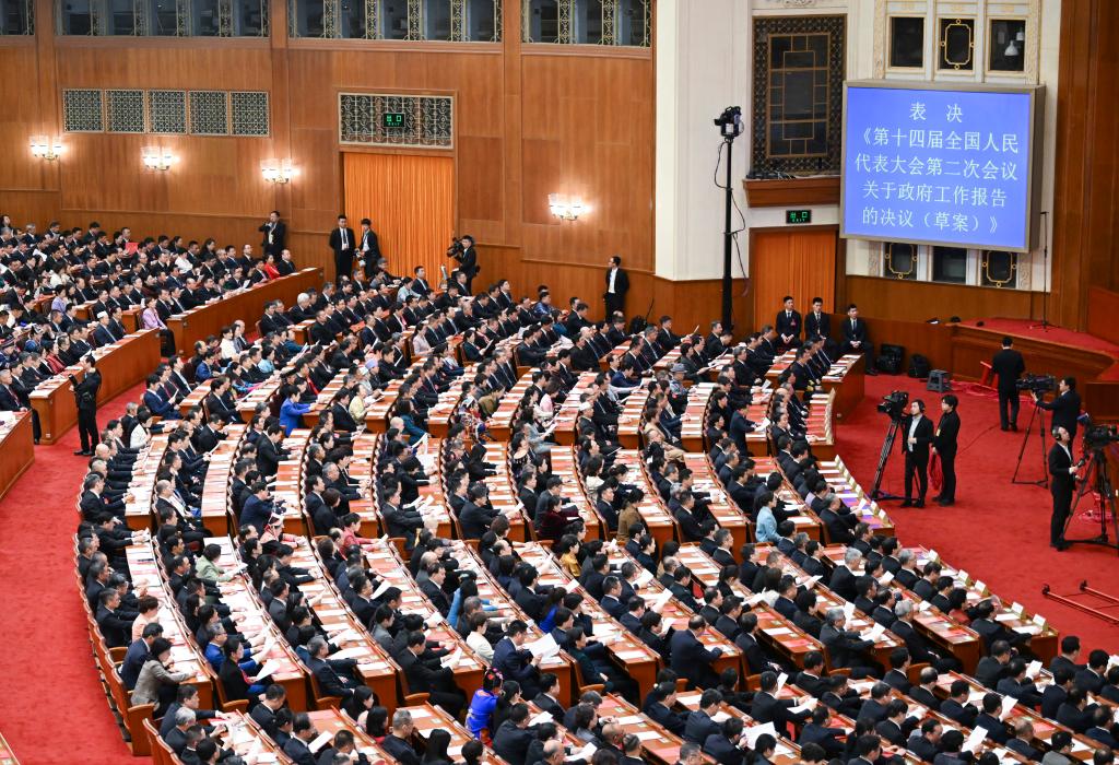 3月11日，第十四届全国人民代表大会第二次会议在北京人民大会堂举行闭幕会。新华社记者 牟宇 摄